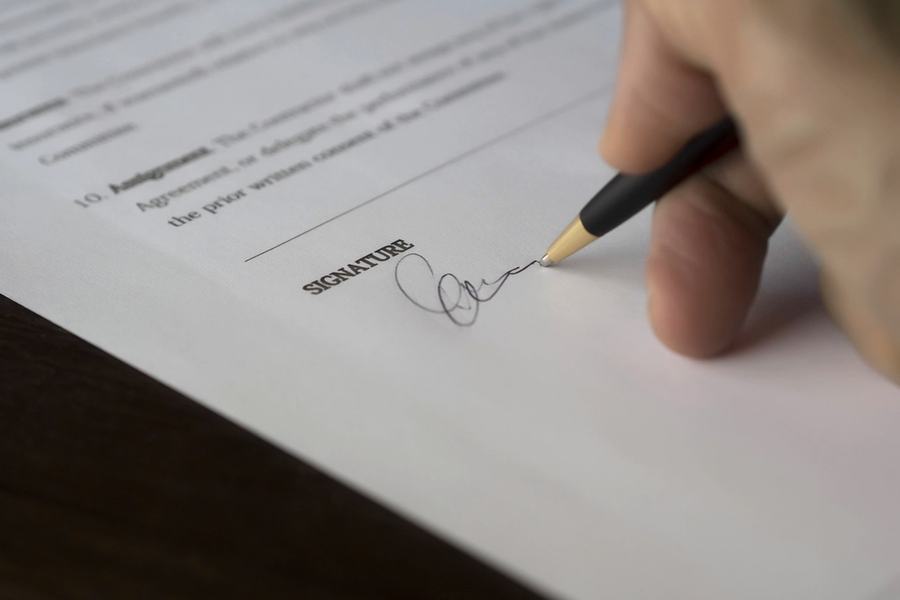 Signing a document with a fountain pen