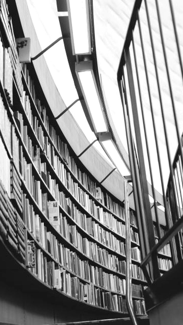 Curved library shelves seen from below